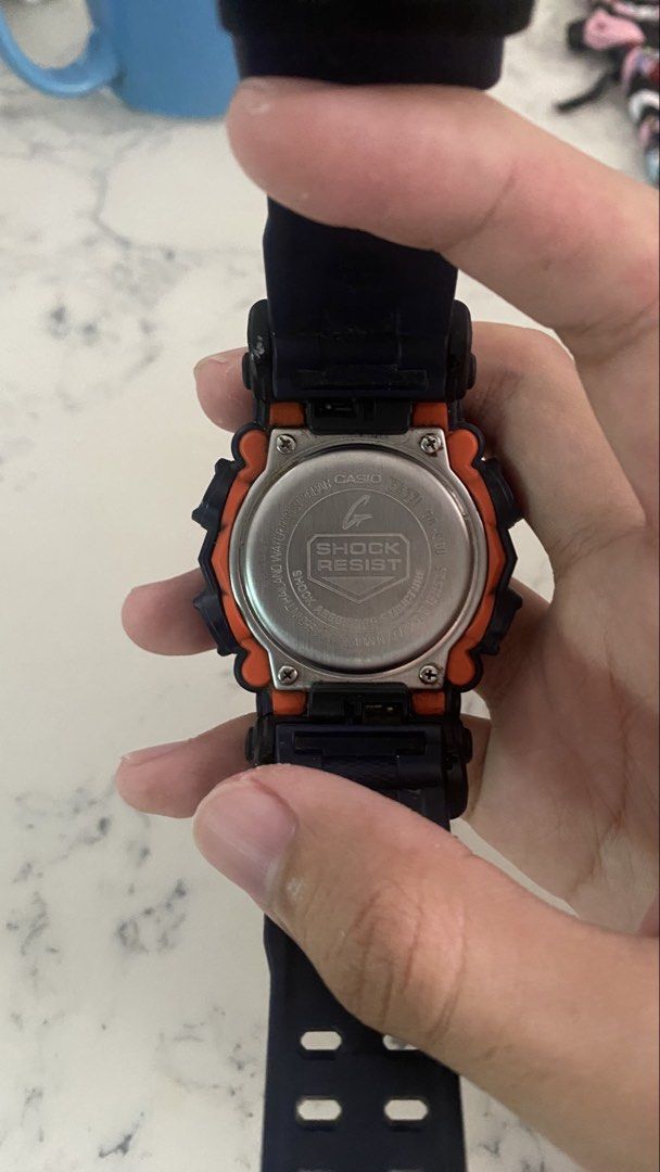 Casio G-Shock Watch (Category: Men's Watches) located in Manila. Submitted by rainecarlos (Listing ID 1461613703, Image 2). Description: - Dark blue G-Shock watch with striking orange accents. - Features both digital and analog display. - Built for toughness: Shock resistant and water resistant up to 20BAR. - Perfect for everyday wear and active sports. - In excellent working condition. Retail price 9k My price 4k.