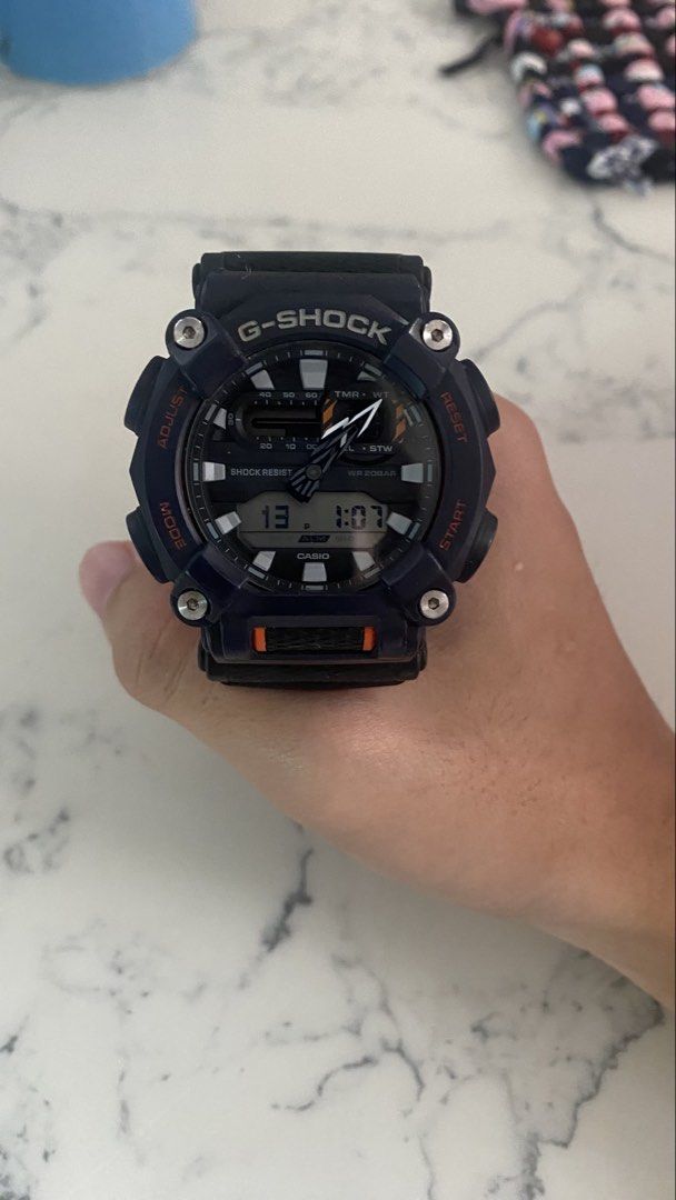 Casio G-Shock Watch (Category: Men's Watches) located in Manila. Submitted by rainecarlos (Listing ID 1461613703, Image 1). Description: - Dark blue G-Shock watch with striking orange accents. - Features both digital and analog display. - Built for toughness: Shock resistant and water resistant up to 20BAR. - Perfect for everyday wear and active sports. - In excellent working condition. Retail price 9k My price 4k.