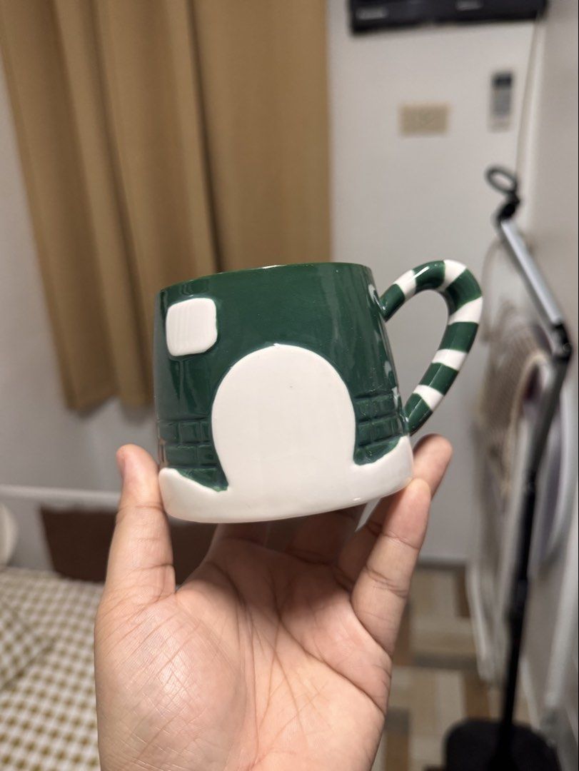 Ceramic Christmas Mug with Striped Handle (Category: Coffee & Tea Tableware) located in Calamba. Submitted by keemi_ (Listing ID 1461739803, Image 1). Description: - ₱230 - Ceramic green mug - Detailed brick pattern - Green and white striped handle - Ideal for morning coffee or tea - Great for holiday gifting or personal use - Perfect for Christmas.