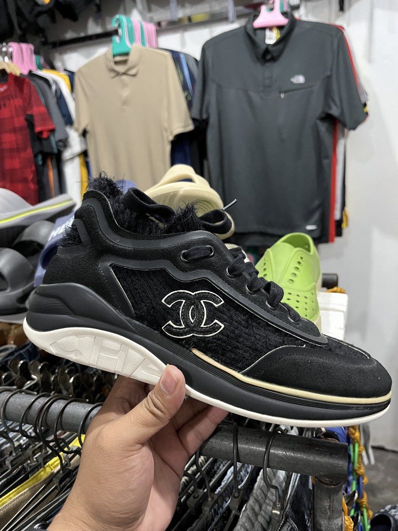 Chanel Black Furry Sneakers (Category: Sneakers) located in Tabuk. Submitted by collectors_thrift_shop (Listing ID 1461676642, Image 1). Description: - Authentic Chanel Sneakers - Color: Black - Size: 40 - Features: Furry details, iconic Chanel logo on the side - Origin: Made in Italy - Condition: Super comfy and stylish - Perfect for: Everyday wear or dressing up an outfit.