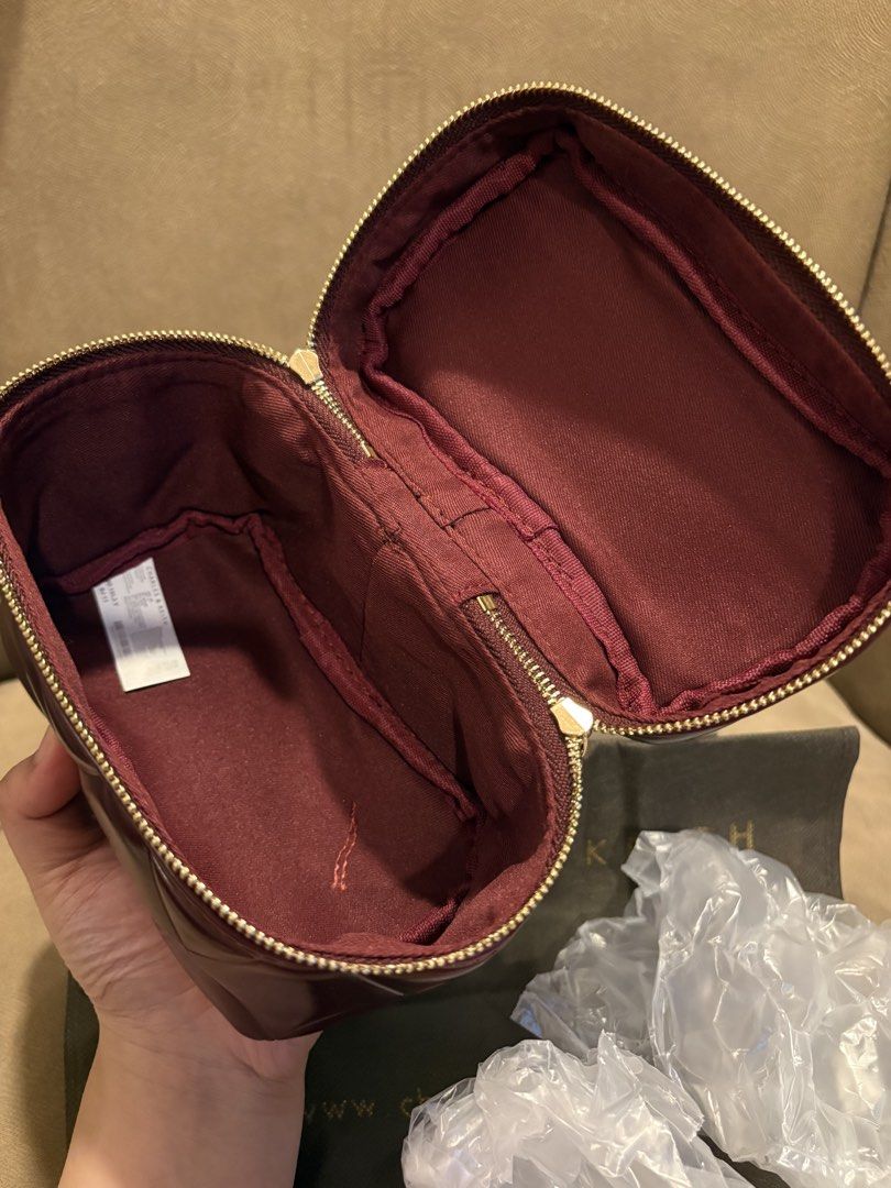Charles & Keith Burgundy Quilted Vanity Case Bag (Category: Luxury Bags & Wallets) located in Muntinlupa City. Submitted by xiannahailey (Listing ID 1461686770, Image 3). Description: - Burgundy quilted vanity case - Brand: Charles & Keith - Gold chain strap included - Zipper closure - Interior zippered pocket - Original box and dust bag included.