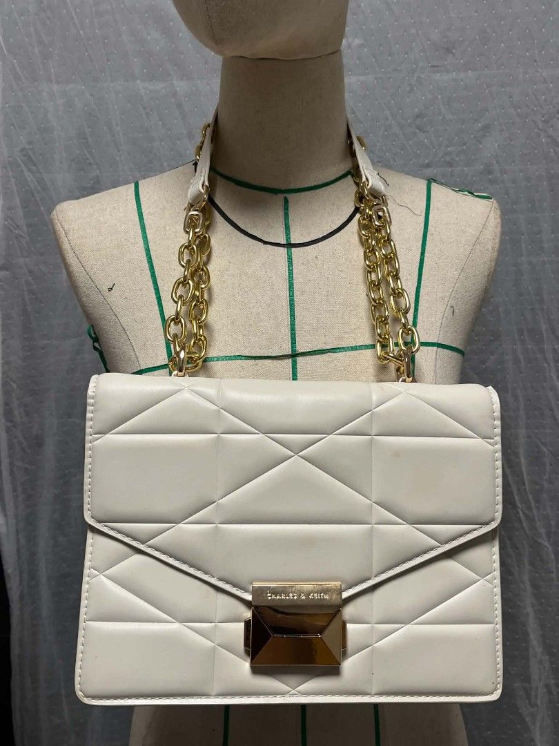 Charles & Keith Cream Geometric Quilted Shoulder Bag (Category: Purses & Pouches) located in Manila. Submitted by elliejenner (Listing ID 1461750528, Image 1). Description: .