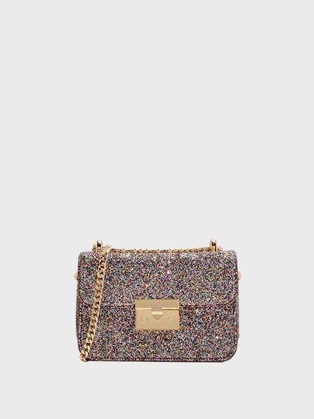 NEGOTIABLE - Charles & Keith Glitter Chain Shoulder Bag (Category: Shoulder Bags) located in Manila. Submitted by prelovedbynatttt_ (Listing ID 1461671899, Image 1). Description: - Sparkly shoulder bag - Gold chain strap - Secure clasp closure - Ideal for nights out or adding glam - Fits essentials (phone, wallet, keys) - Gold hardware details - Bag is clean inside and out Negotiable for sure buyer. Send offer.