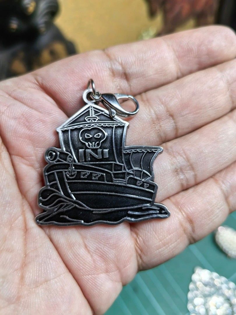 Charm (Category: Charms) located in Cebu City. Submitted by dudes_villanueva (Listing ID 1461583243, Image 3). Description: Charm - INI Fan Club Membership Renewal Bonus Charm 📌 Shaped like a ship with a skull emblem and the letters "INI". 📌 In excellent condition..
