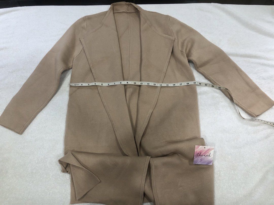 Chicwish Beige Knit Cardigan with Pockets (Category: Coats, Jackets and Outerwear) located in Manila. Submitted by janmichael26601 (Listing ID 1461587177, Image 1). Description: - Beige knit cardigan from Chicwish - Open front style with long sleeves - Features two convenient side pockets - Made of soft 100% acrylic material - Measurements: Chest (laid flat) approx. 22 inches, Length approx. 35 inches - Ideal for effortless layering over any outf