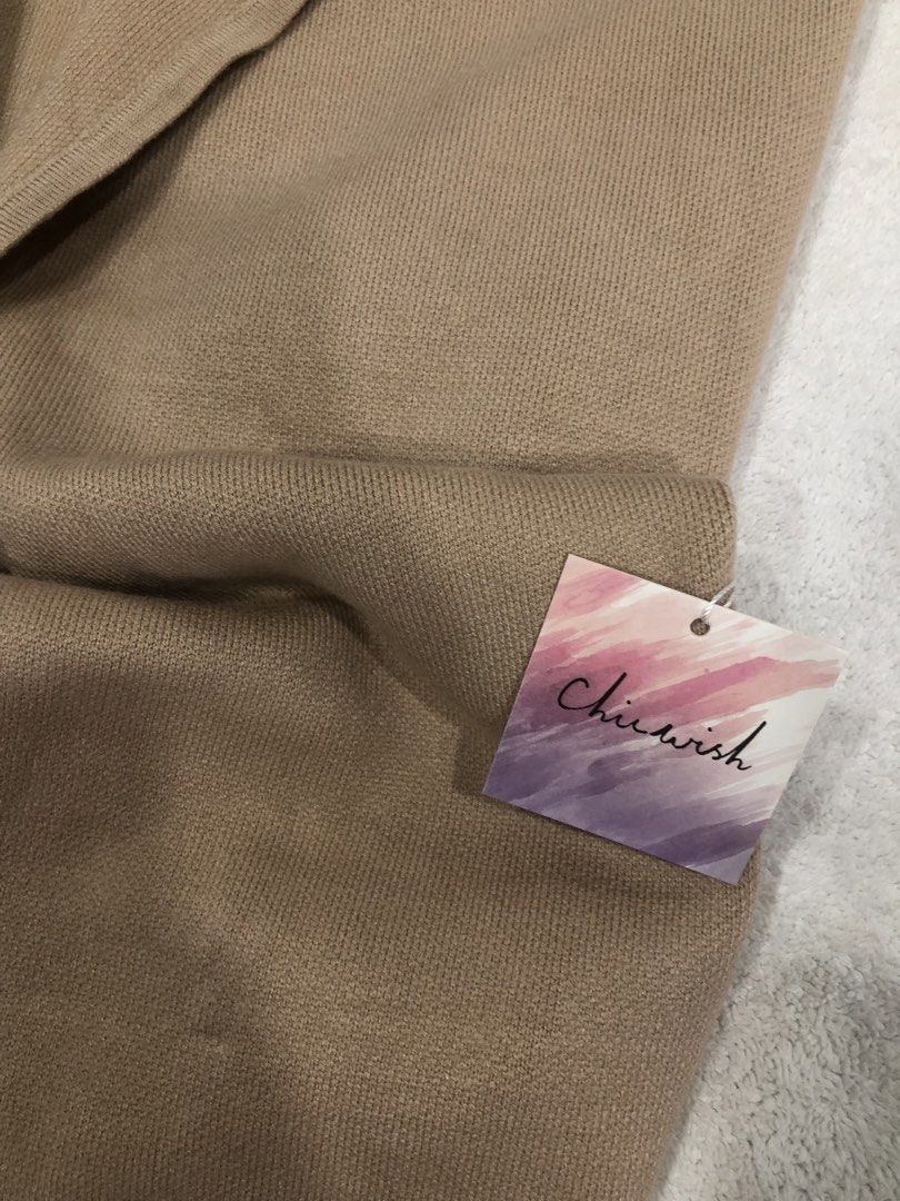 Chicwish Beige Knit Cardigan with Pockets (Category: Coats, Jackets and Outerwear) located in Manila. Submitted by janmichael26601 (Listing ID 1461587177, Image 2). Description: - Beige knit cardigan from Chicwish - Open front style with long sleeves - Features two convenient side pockets - Made of soft 100% acrylic material - Measurements: Chest (laid flat) approx. 22 inches, Length approx. 35 inches - Ideal for effortless layering over any outf