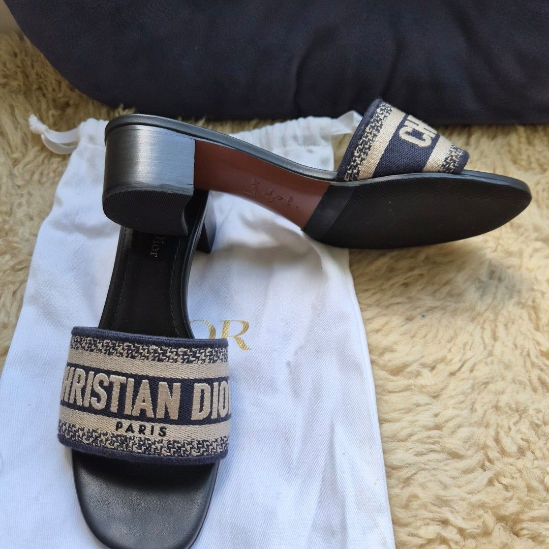 Christian Dior Dway Slide Sandals (Category: Flats & Sandals) located in Quezon City. Submitted by deng43763 (Listing ID 1461569337, Image 3). Description: - Authentic Dior Dway slide sandals - Color: Beige and Navy canvas - Design: Christian Dior Paris embroidery - Heel type: Block heel - Size: 37 - Origin: Made in Italy - Includes: Original dust bag.