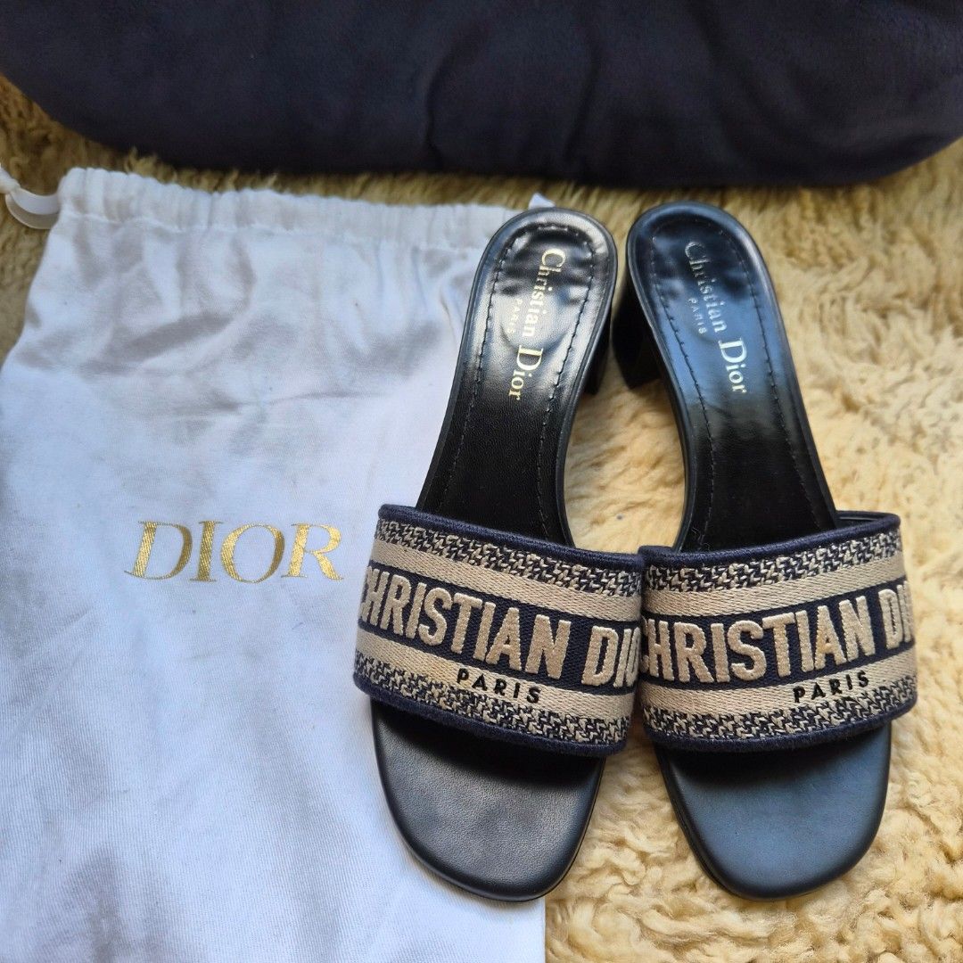 Christian Dior Dway Slide Sandals (Category: Flats & Sandals) located in Quezon City. Submitted by deng43763 (Listing ID 1461569337, Image 1). Description: - Authentic Dior Dway slide sandals - Color: Beige and Navy canvas - Design: Christian Dior Paris embroidery - Heel type: Block heel - Size: 37 - Origin: Made in Italy - Includes: Original dust bag.