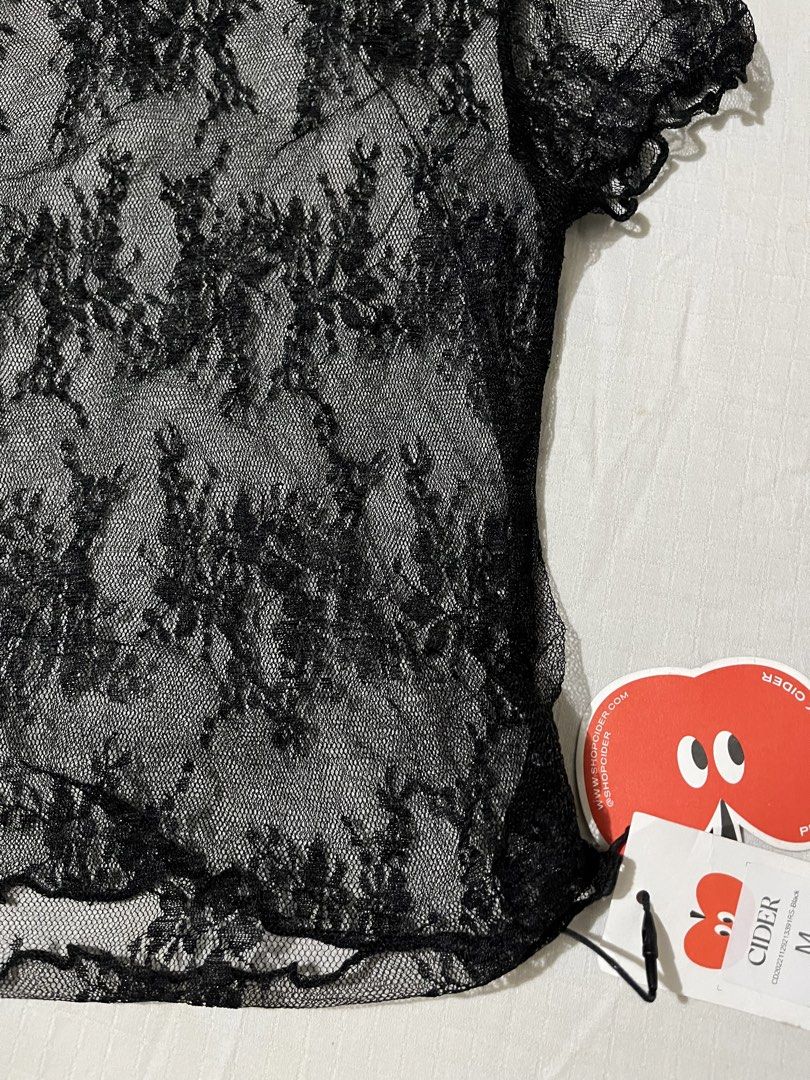 Cider Black Lace Sheer Mesh Top Size M (Category: Sleeveless) located in Quezon City. Submitted by earthtodior (Listing ID 1461795405, Image 2). Description: - Cute black lace top from Cider - Sheer mesh material with a floral pattern - Short sleeves - Lettuce hem details - Perfect for layering over a bralette or cami - Adds an edgy touch to any outfit.