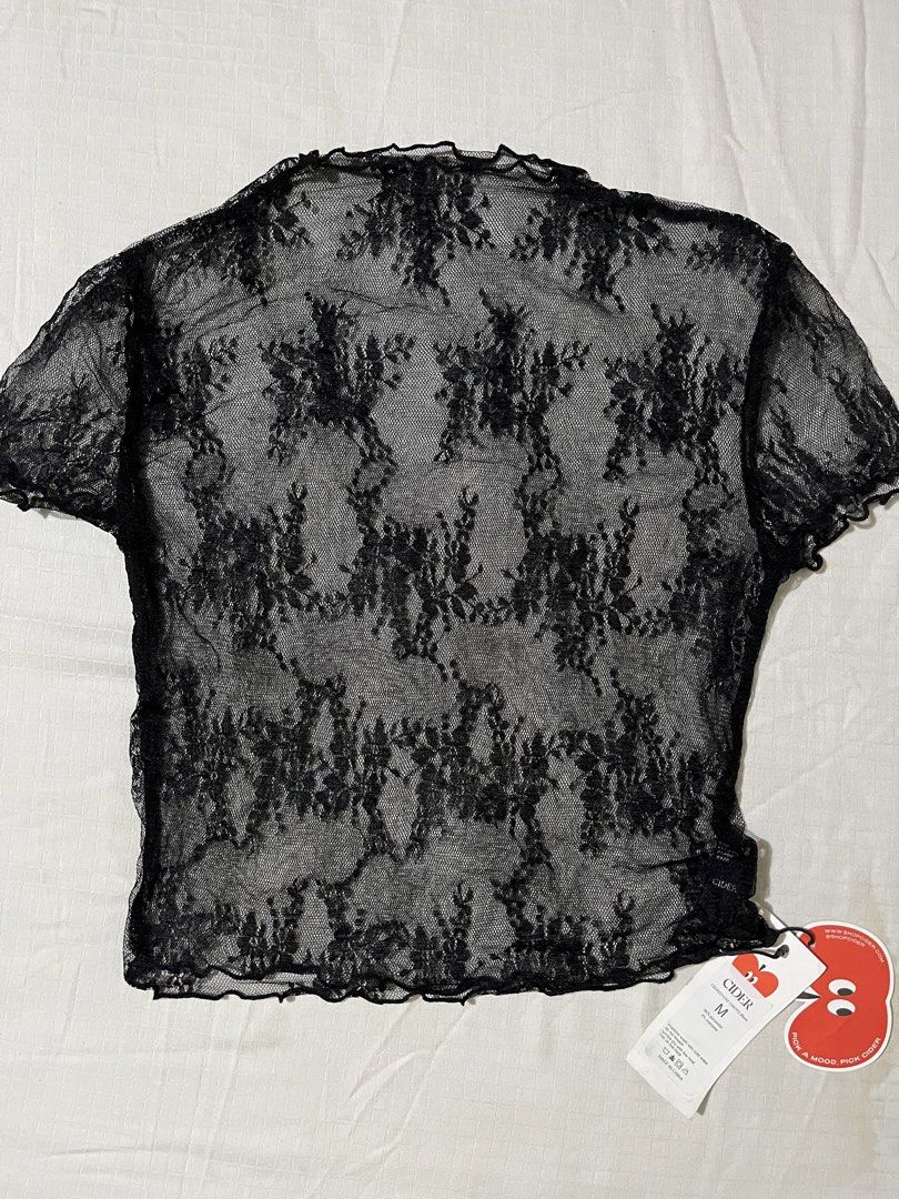 Cider Black Lace Sheer Mesh Top Size M (Category: Sleeveless) located in Quezon City. Submitted by earthtodior (Listing ID 1461795405, Image 1). Description: - Cute black lace top from Cider - Sheer mesh material with a floral pattern - Short sleeves - Lettuce hem details - Perfect for layering over a bralette or cami - Adds an edgy touch to any outfit.