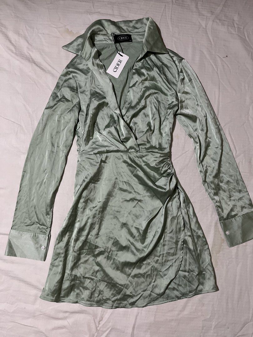 CIDER Green Satin Collared Wrap Mini Dress (Category: Dresses) located in Quezon City. Submitted by earthtodior (Listing ID 1461795518, Image 2). Description: - XS on tag but can fit up to small - Long sleeves with button cuffs - Ruched detail on the side - Collared neckline - Perfect for a night out or special occasion - Still has original tags attached.