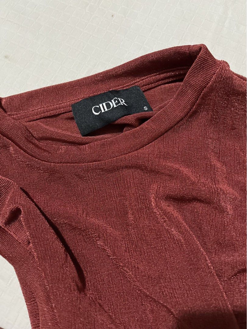 Cider Red Ruched Tie Side Sleeveless Top (Category: Sleeveless) located in Quezon City. Submitted by earthtodior (Listing ID 1461795574, Image 3). Description: - Cute Cider top - Reddish-brown color - Ruched design with side tie details - Sleeveless style - Subtle shimmer fabric - Size S.