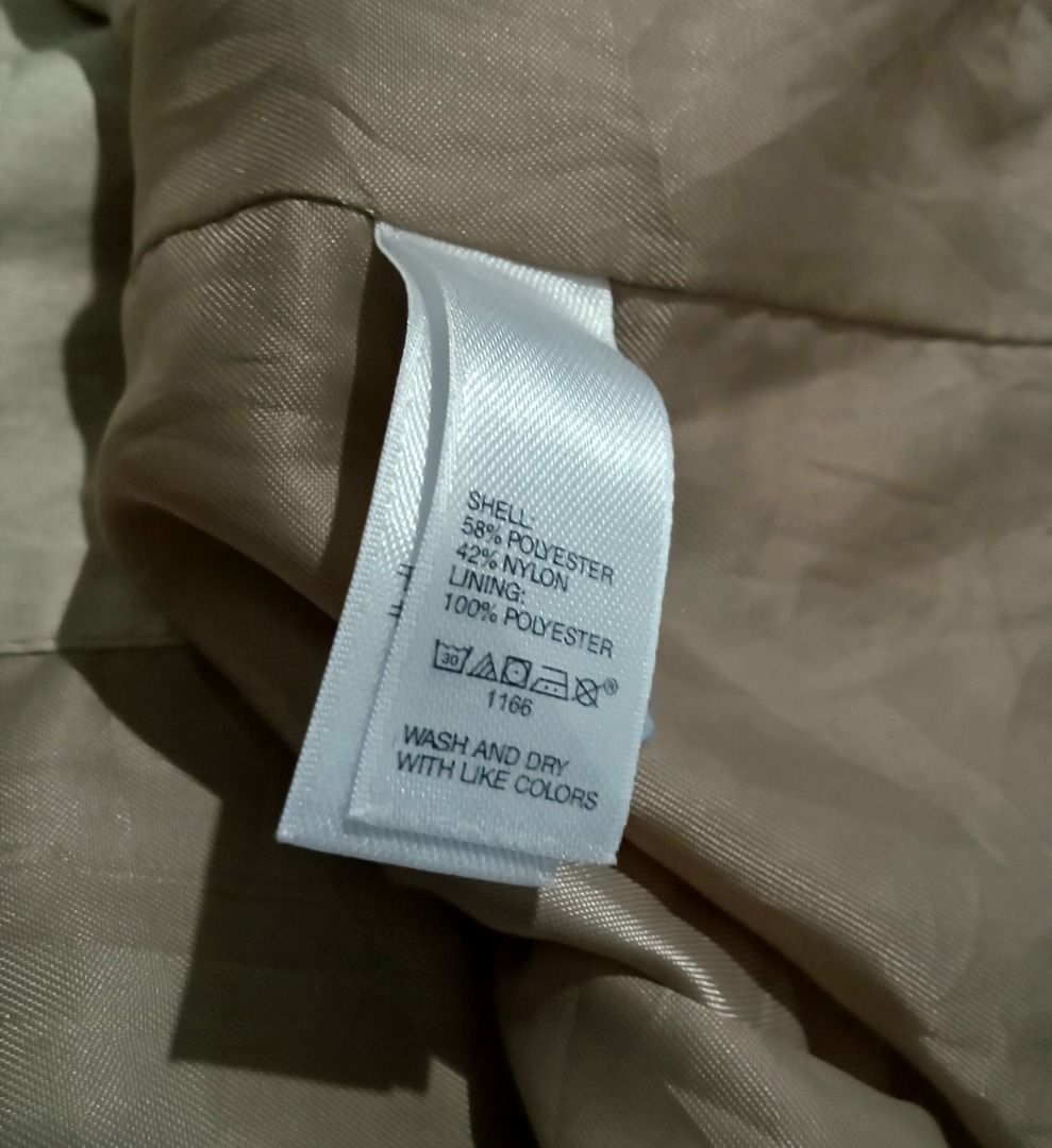 Classic Gap Utility Hooded Trench Coat (Category: Coats, Jackets and Outerwear) located in Baguio. Submitted by pure_vntg53 (Listing ID 1461720731, Image 3). Description: GAP(Authentic Indonesian import) Material: Heavy-duty, water resistant tech shell with a smooth inner lining( 58% polyester, 42% nylon). Features: Removable hood, adjustable cinched drawstring waist, asymmetrical gun flap and unique tied cuff details. Measurements: Pit-pit: 18.5