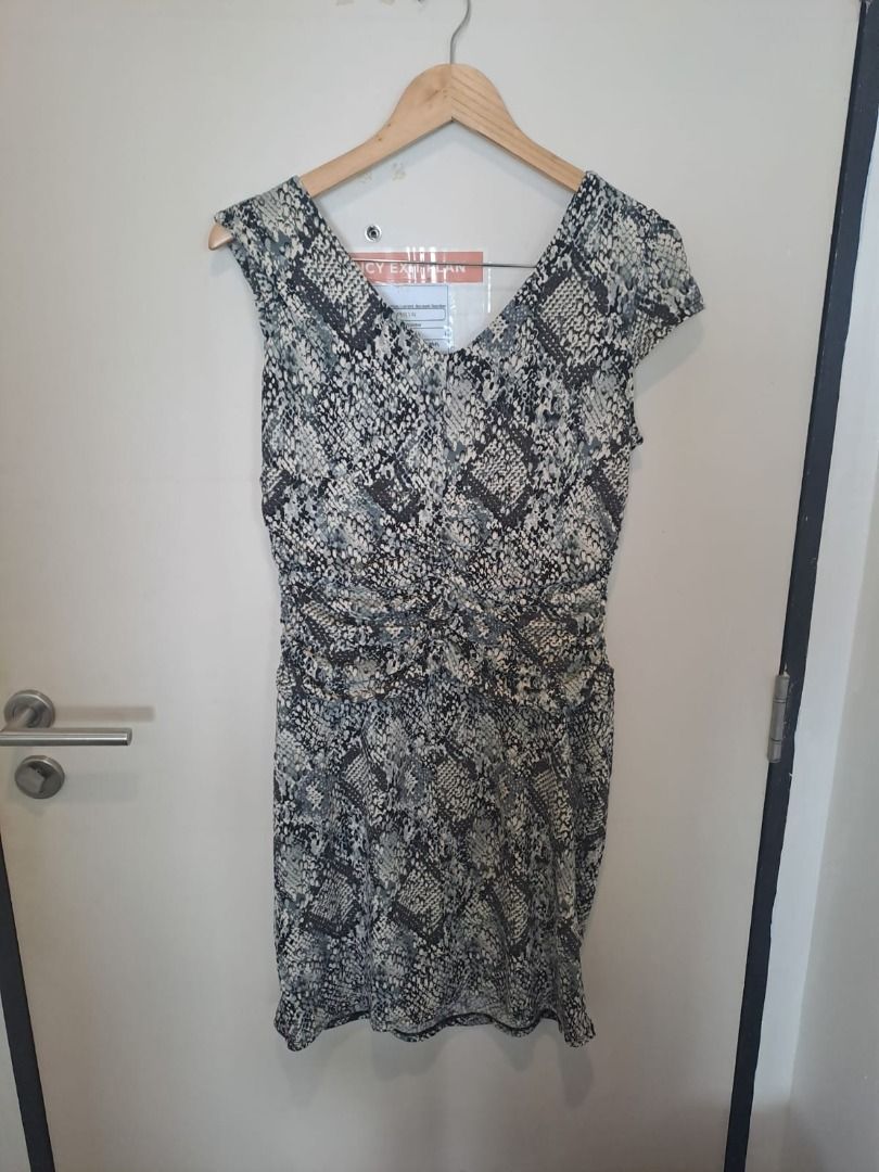 cleo petite python dress (Category: Dresses) located in Mandaluyong City. Submitted by epicowl-c93c (Listing ID 1461768605, Image 2). Description: The image shows a grey and black snakeskin python print faux wrap dress from the brand Cleo Petites. It features a V-neckline, cap sleeves, a gathered draped front, and side ruching..