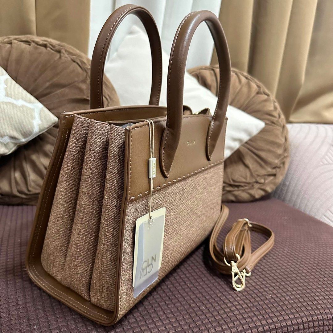 CLN Brown Textured Tote Bag with Shoulder Strap (Category: Tote Bags) located in Manila. Submitted by decluttergly (Listing ID 1461589468, Image 3). Description: - Cute brown tote bag from CLN - Textured fabric panel on front and sides - Comes with a detachable shoulder strap - Multiple compartments inside for organization - Brand new with original tags attached - Ideal for everyday use or work.