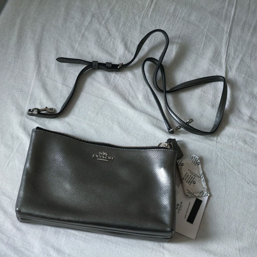 Coach | Metallic Crossbody Bag with Strap (Category: Cross-body Bags) located in Taguig. Submitted by tureesha (Listing ID 1461693572, Image 1). Description: RFS: Decluttering 📌 PLEASE READ BEFORE SENDING AN OFFER 📸 CONDITION • As described and shown in photos. Please review all photos and the description before offering. Feel free to ask for more photos or details, happy to send. ✅ ALL SALES ARE FINAL • No returns or refunds once handed over. 