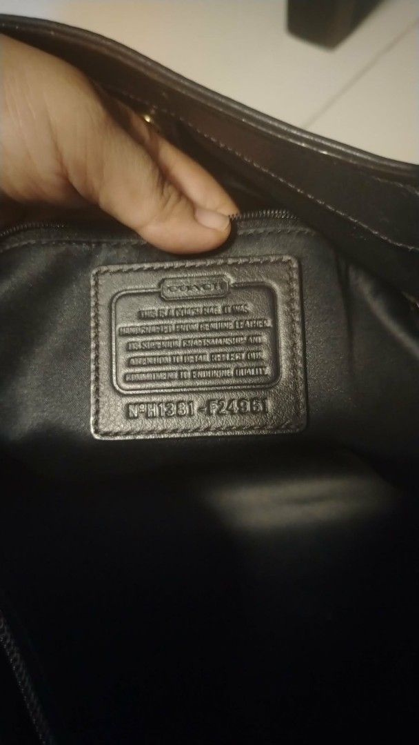 Coach Black Leather Shoulder Bag (Category: Tote Bags) located in Manila. Submitted by wildwind_73f77a (Listing ID 1461587320, Image 2). Description: - Classic navy blue Coach leather shoulder bag - Features a gold buckle detail on the front pocket - Spacious interior for all your essentials - Comfortable straps for easy carrying - Ideal for everyday use - Shows some signs of wear, but plenty of life left.