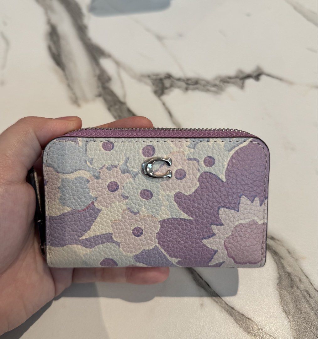 Coach Floral Print Zip Coin Pouch (Category: Purses & Pouches) located in Manila. Submitted by twicelovedbyjc (Listing ID 1461694325, Image 1). Description: 💜Preloved Authentic Coach Floral print essential Zip around card wallet 💜Used - Like New 💜with Tag 📌Slightly Negotiable.