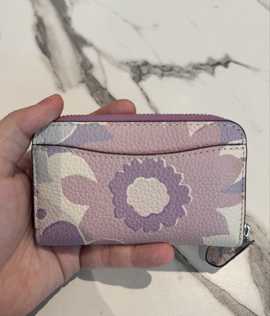 Coach Floral Print Zip Coin Pouch (Category: Purses & Pouches) located in Manila. Submitted by twicelovedbyjc (Listing ID 1461694325, Image 2). Description: 💜Preloved Authentic Coach Floral print essential Zip around card wallet 💜Used - Like New 💜with Tag 📌Slightly Negotiable.