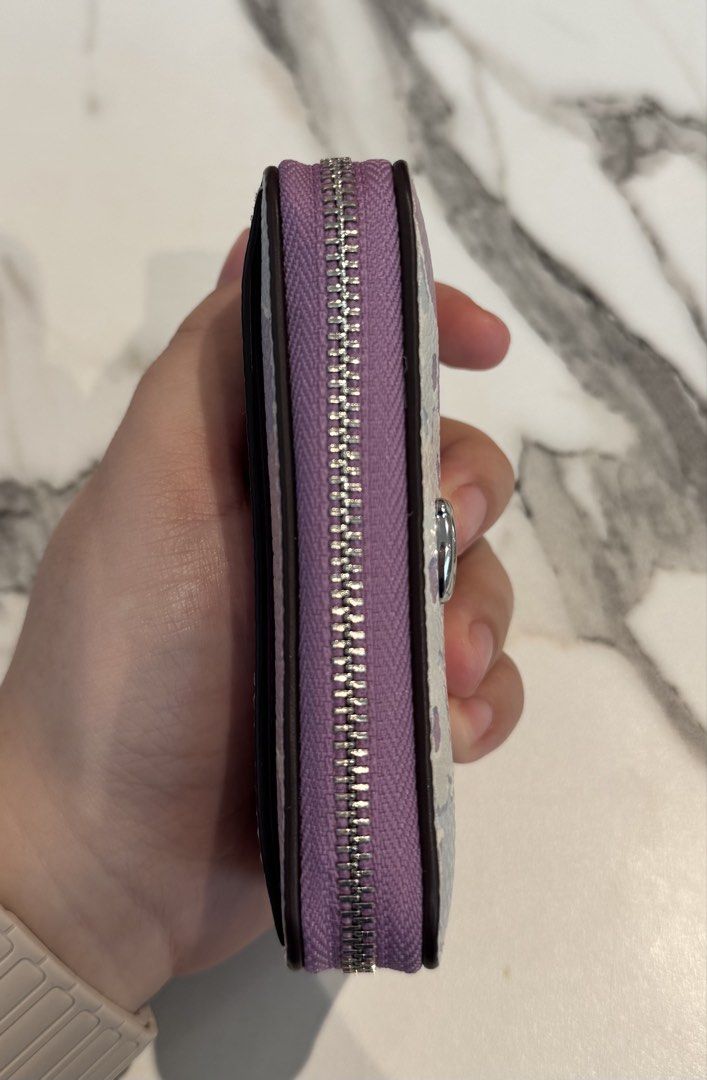Coach Floral Print Zip Coin Pouch (Category: Purses & Pouches) located in Manila. Submitted by twicelovedbyjc (Listing ID 1461694325, Image 3). Description: 💜Preloved Authentic Coach Floral print essential Zip around card wallet 💜Used - Like New 💜with Tag 📌Slightly Negotiable.