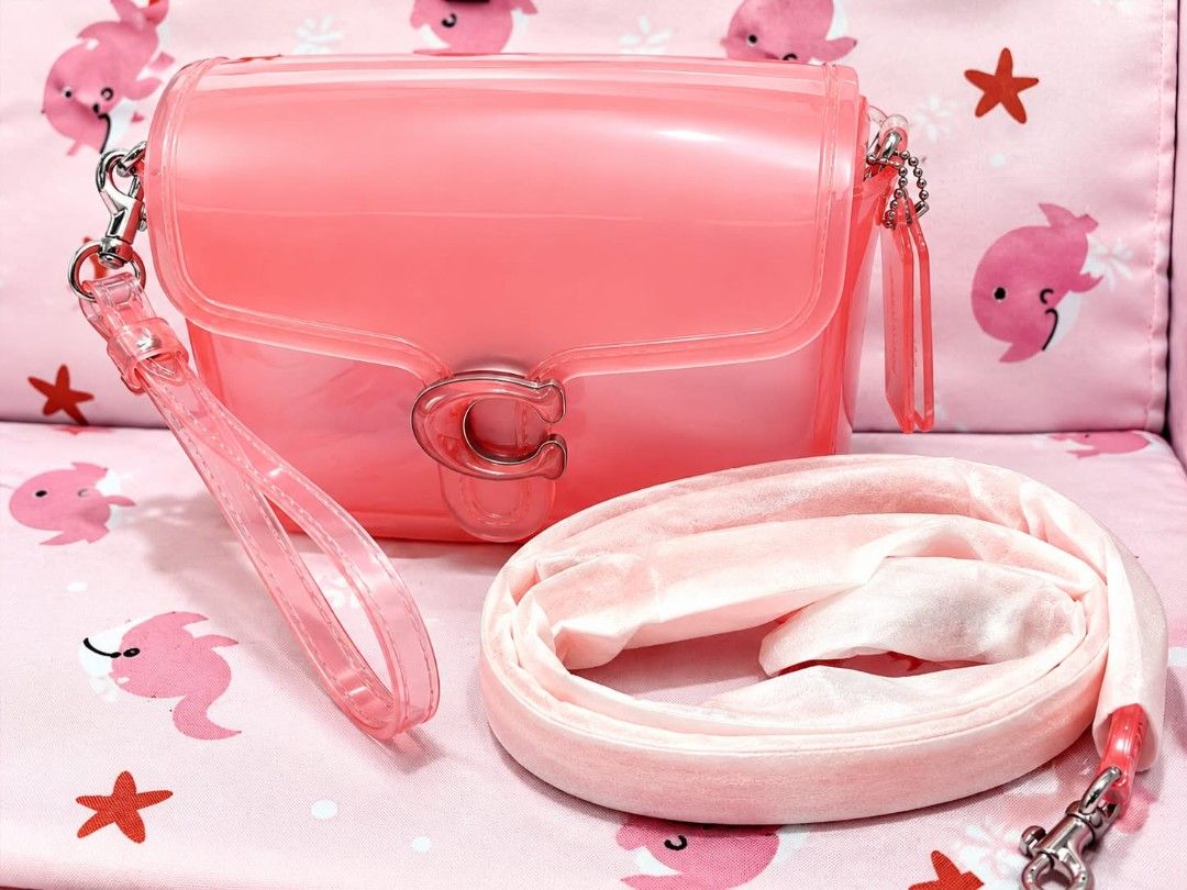 Coach Jelly Tabby Shoulder Bag Pink (Category: Shoulder Bags) located in Mandaluyong City. Submitted by Love.Boutique (Listing ID 1461769762, Image 1). Description: - AUTHENTIC. MONEY BACK IF PROVEN FAKE Small size - Adorable pink jelly bag from Coach - Features the iconic C logo closure - Comes with a detachable wrist strap - Includes a soft velvet shoulder strap for versatile carrying - Adds a fun pop of color to any outfit - Ideal for carrying