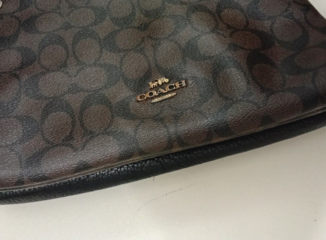 Coach MIA Shoulder Bag (Category: Luxury Bags & Wallets) located in Manila. Submitted by eriiicaspage (Listing ID 1461696348, Image 2). Description: PreOwned WellUsed Authentic COACH MIA Signature Monogram Canvas leather Shoulder bag - Signature monogram print (brown & black) - Genuine leather trim and strap - Secure zipper closure - Interior slip pocket - Adjustable strap for customized fit - Ideal for everyday carry Sign of Used Good Condition 