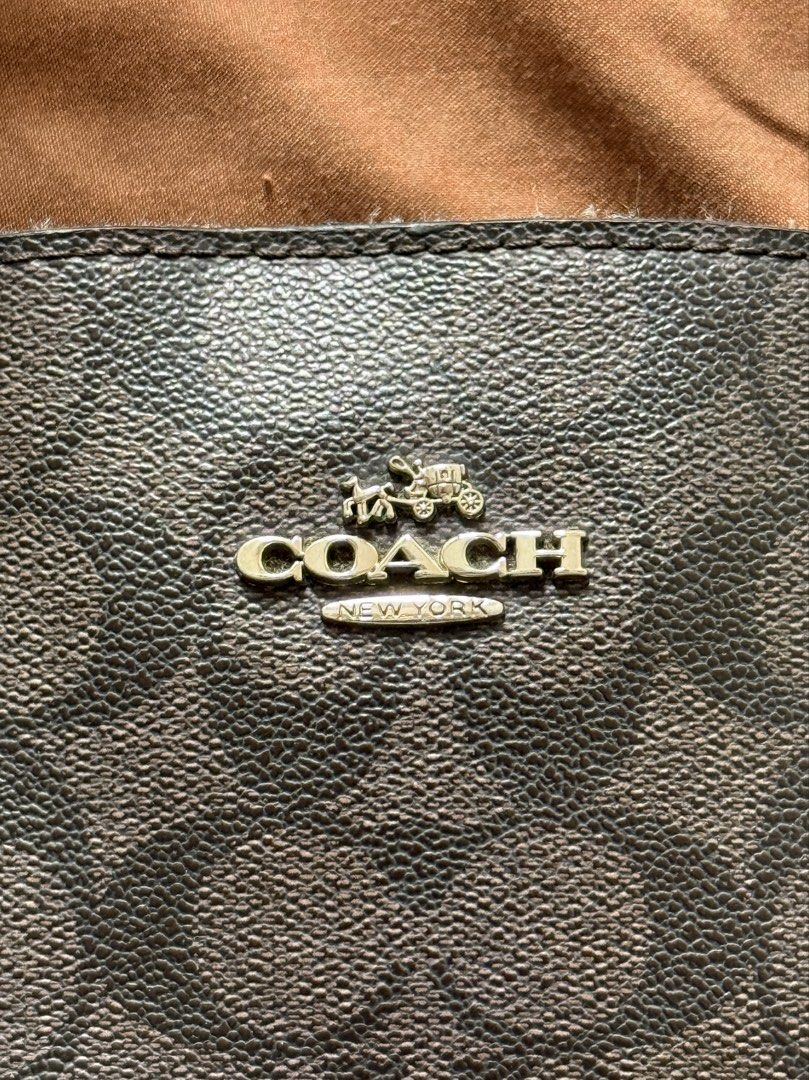 Coach Sage Large Signature Brown Black (Category: Luxury Bags & Wallets) located in Pasig City. Submitted by lovedbymara_maiara (Listing ID 1461701844, Image 2). Description: Decluttering my Personal Preloved Bag Coach F29683 Sage Large Signature Brown Black Material: Coated canvas and leather Stamp: A1832 F29683 Interior: Two snap closure compartments, one open pocket and one zip compartment Measurements: 12”L X 4.75”W X 9.5”H Handle Drop: 4.5” 