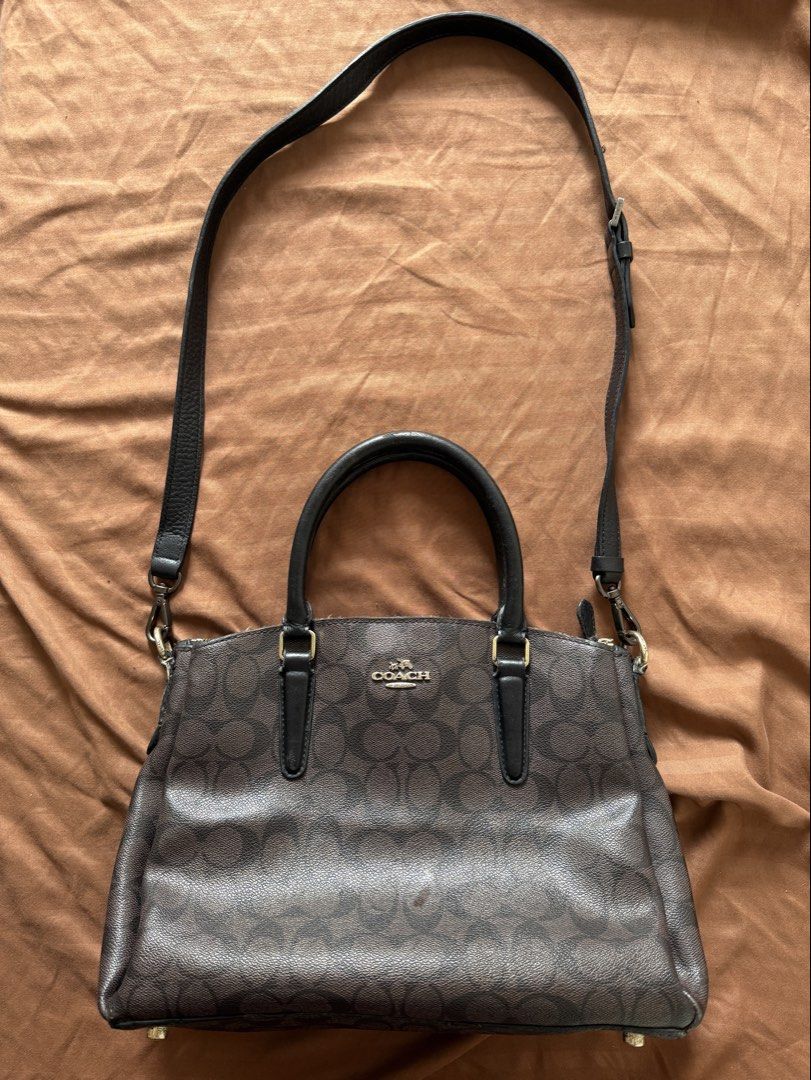 Coach Sage Large Signature Brown Black (Category: Luxury Bags & Wallets) located in Pasig City. Submitted by lovedbymara_maiara (Listing ID 1461701844, Image 1). Description: Decluttering my Personal Preloved Bag Coach F29683 Sage Large Signature Brown Black Material: Coated canvas and leather Stamp: A1832 F29683 Interior: Two snap closure compartments, one open pocket and one zip compartment Measurements: 12”L X 4.75”W X 9.5”H Handle Drop: 4.5” 