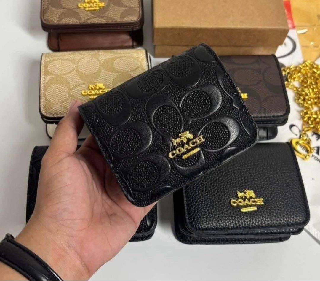 Coach Signature C Monogram & Embossed Leather Wallets with Chain (Category: Wallets & Card holders) located in Manila. Submitted by mimi4373 (Listing ID 1461766788, Image 2). Description: Coach Mini Sling, Brand New With Box, Dust Bag, Authentication Card. ₱499.