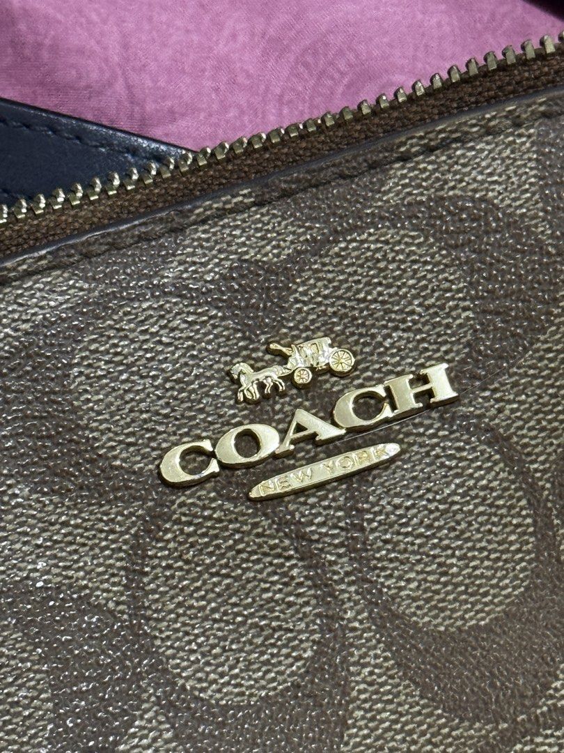 Coach Signature Monogram Satchel Bag (Category: Luxury Bags & Wallets) located in Bauang. Submitted by jeneefromtheblock (Listing ID 1461774163, Image 2). Description: - Brown Coach satchel bag - Signature Coach monogram print - Elegant gold hardware details - Multiple interior pockets for easy organization - Includes a detachable crossbody strap for versatile wear - Noted minor wear on the edge of the strap and zipper pull - Ideal everyday bag f