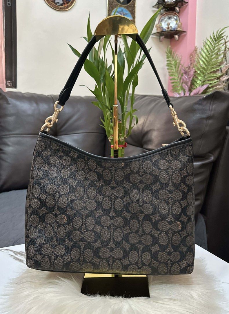 Coach Signature Monogram Shoulder Bag with Strap (Category: Luxury Bags & Wallets) located in Cebu City. Submitted by ludz_0246_2.0 (Listing ID 1461726075, Image 2). Description: - Classic Coach signature monogram print - Color: Dark brown and tan - Detachable crossbody strap included - Interior: 1 zip pocket, slip pockets - Gold hardware details - Ideal for everyday use.