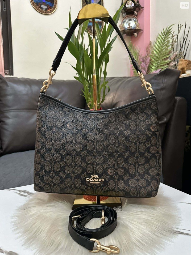 Coach Signature Monogram Shoulder Bag with Strap (Category: Luxury Bags & Wallets) located in Cebu City. Submitted by ludz_0246_2.0 (Listing ID 1461726075, Image 1). Description: - Classic Coach signature monogram print - Color: Dark brown and tan - Detachable crossbody strap included - Interior: 1 zip pocket, slip pockets - Gold hardware details - Ideal for everyday use.
