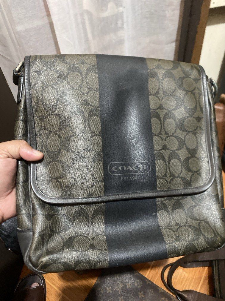 COACH SLING BAG (Category: Sling Bags) located in Manila. Submitted by junejanuary (Listing ID 1461748520, Image 1). Description: - Authentic Coach sling bag - Classic Coach monogram pattern - Features a stylish black vertical stripe - Embossed 'Coach Est. 1941' logo detail - Ideal for everyday carry and organization.