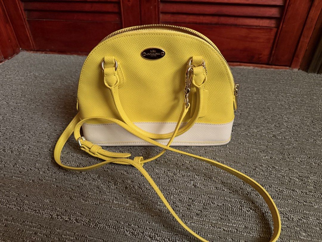 Coach Yellow/White Mini Cora Domed (Category: Cross-body Bags) located in San Juan, Ilocos Sur. Submitted by swiftfire.f9f998 (Listing ID 1461576968, Image 2). Description: Brand new Mini Cora Domed Yellow/White color Dual top handles Detachable shoulder strap.