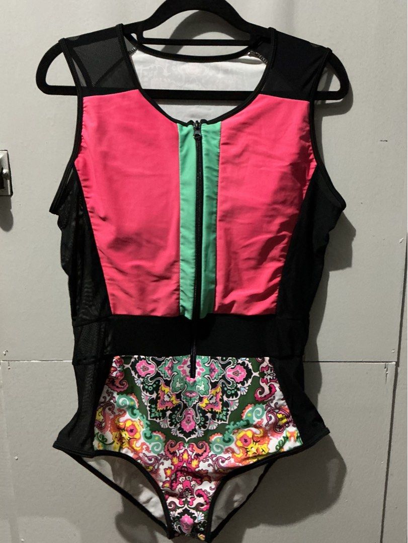 Colorful One-Piece Swimsuit with Mesh Panels (Category: Bikinis & Swimsuits) located in Bulacan. Submitted by toogoodtobegarbage (Listing ID 1461695013, Image 1). Description: - Eye-catching one-piece swimsuit with a bright, bold design. - Features a vibrant patterned front and back panel. - Stylish black mesh detailing on the sides and shoulders. - Convenient front zipper closure. - Unique design for a standout look. - Ideal for beach days or po
