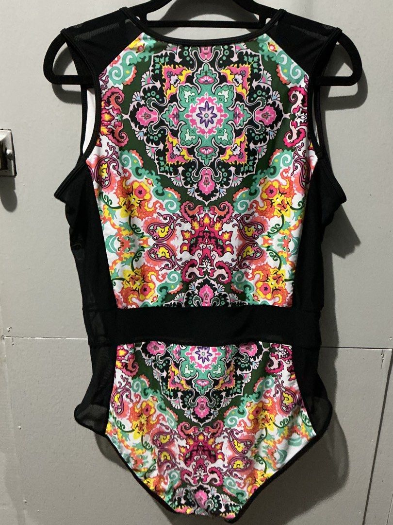 Colorful One-Piece Swimsuit with Mesh Panels (Category: Bikinis & Swimsuits) located in Bulacan. Submitted by toogoodtobegarbage (Listing ID 1461695013, Image 2). Description: - Eye-catching one-piece swimsuit with a bright, bold design. - Features a vibrant patterned front and back panel. - Stylish black mesh detailing on the sides and shoulders. - Convenient front zipper closure. - Unique design for a standout look. - Ideal for beach days or po