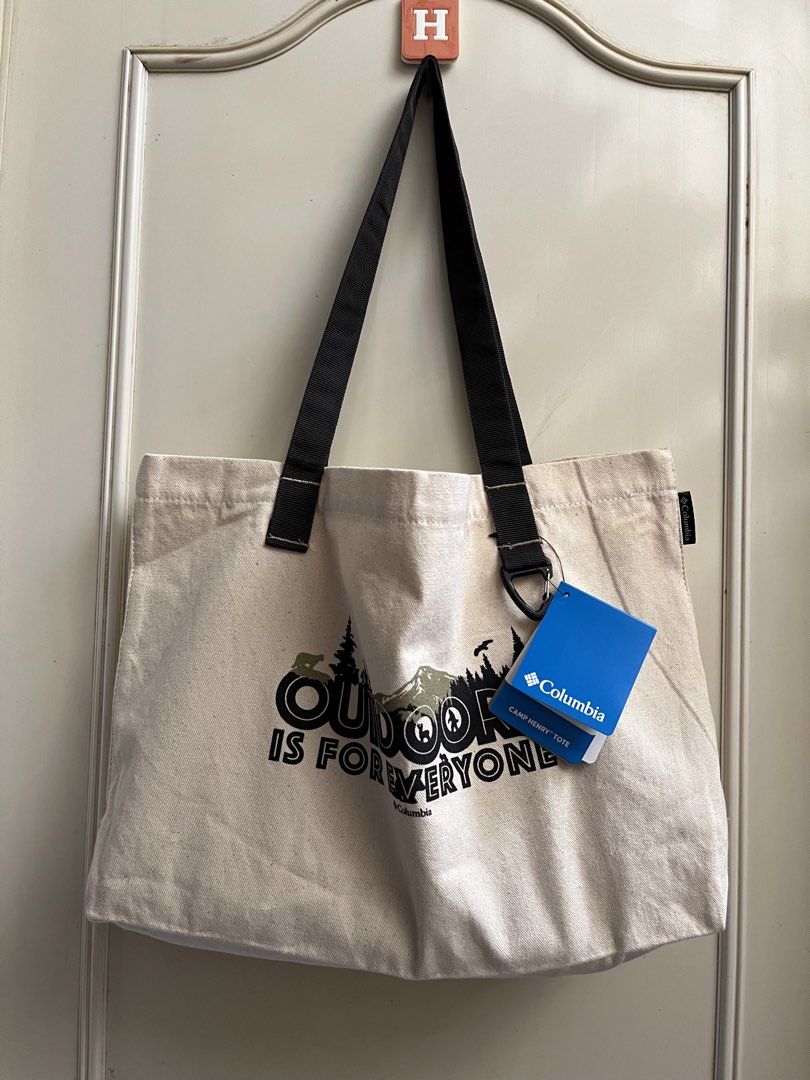Columbia Camp Henry Tote Bag (Category: Tote Bags) located in Calapan. Submitted by shakalak (Listing ID 1461710833, Image 2). Description: - Brand: Columbia - Design: "Outdoor is Forever Everyone" graphic -Size L-18/H 11/W 4 - Material: Durable canvas - Features: Internal mesh pocket - Condition: Brand new with original tags attached - Ideal for: Outdoor adventures, everyday essentials.