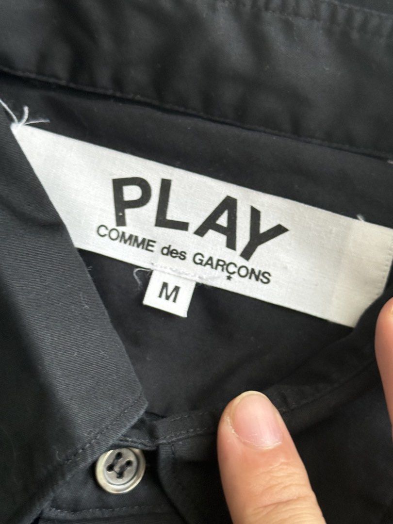 Comme Des Garcons Long Sleeve (Category: Tshirts & Polo Shirts ) located in Quezon City. Submitted by bigrackzzz (Listing ID 1461638246, Image 3). Description: - Brand: Comme des Garçons Play - Item: Button-up Shirt - Size: Medium (M) - Features: Iconic heart logo on chest, collared neckline - Style: Casual, versatile for layering - Condition: Excellent 20x28.