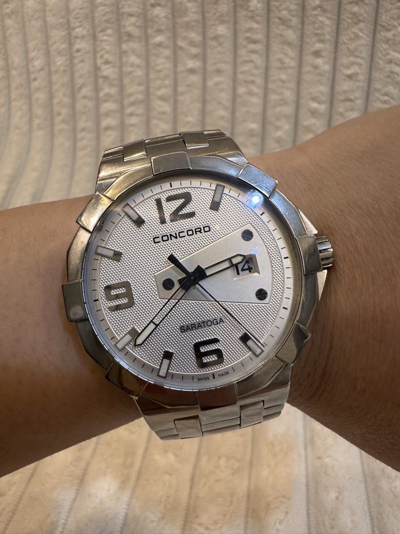 Concord Saratoga (Category: Luxury Watches) located in Pasig City. Submitted by surplusatbp (Listing ID 1461570040, Image 1). Description: Concord Saratoga Luxury Sport Watch Description: Premium Swiss-made luxury sport watch from Concord’s iconic Saratoga line, defined by its signature sculpted bezel design and sophisticated textured dial architecture. Case Size: 40 mm | Wrist Size: Fits up to 16.5 cm Features & Selling Points: * Distinctive sil
