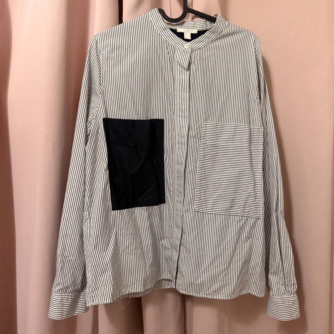 COS Striped Shirt with Blue Patch Detail (Category: Longsleeves) located in Paranaque City. Submitted by prelovednibianca (Listing ID 1461705685, Image 1). Description: - COS Long-Sleeved Shirt - Classic pinstripe pattern - Dark blue patch on left chest - Dark blue panel on the back - Mandarin collar with button closure - Size: EUR 42 📍 Item will be coming from PARAÑAQUE. 📦 Delivery via Lalamove or J&T. ⏰ Next-day pickup cutoff is 10:30PM. ✔️ D