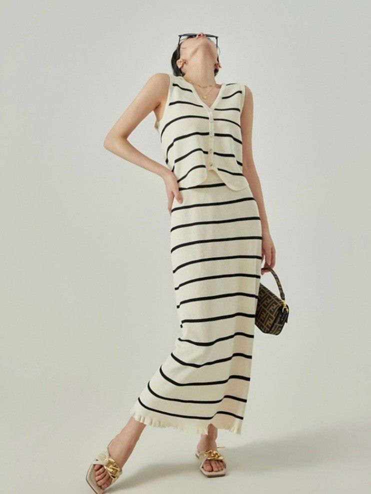 Cream & Black Striped Knit Set (Category: Sets or Coordinates) located in Malabon City. Submitted by ahmabanana (Listing ID 1461779813, Image 1). Description: - Cream knit set with black stripes - Sleeveless V-neck vest with button front - Midi skirt with ruffled hem - Wear together or separately.