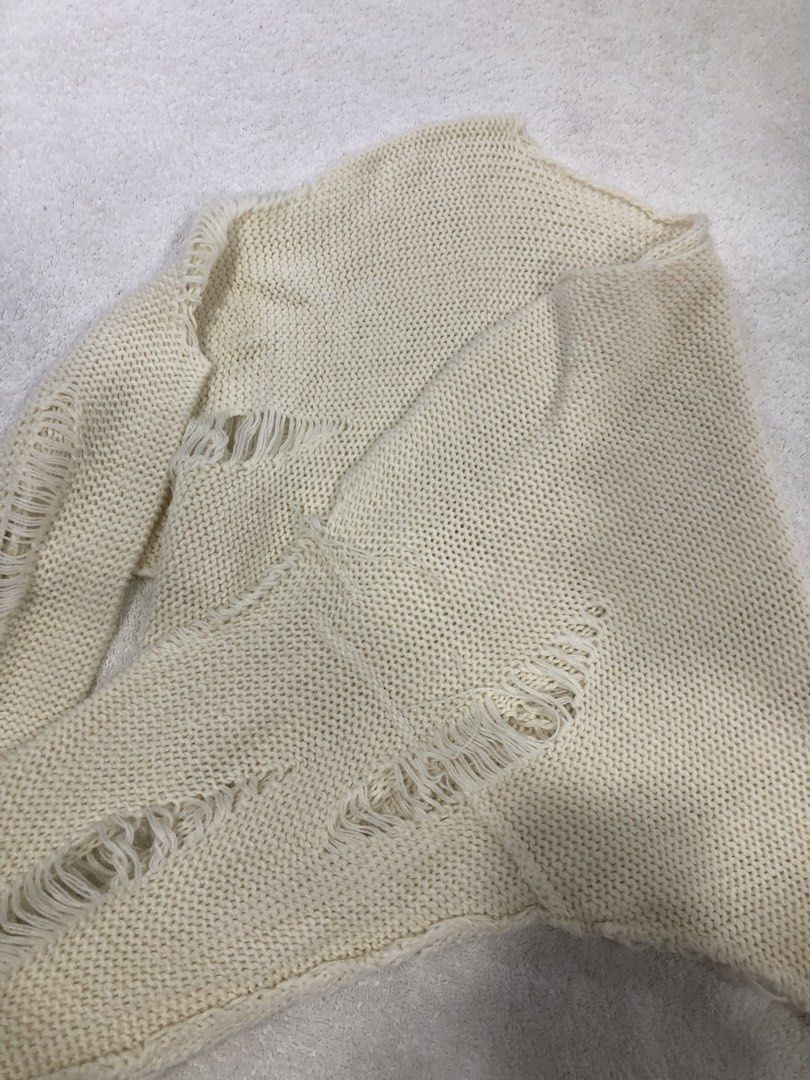 Cream Distressed Knit Cropped Sweater (Category: Longsleeves) located in Manila. Submitted by janmichael26601 (Listing ID 1461591447, Image 3). Description: - Cream knit sweater - Cropped style - Distressed details on sleeves and hem - Estimated size: Medium - Measurements: Chest approx. 20 inches, Length approx. 18 inches - Ideal for layering or casual outfits.