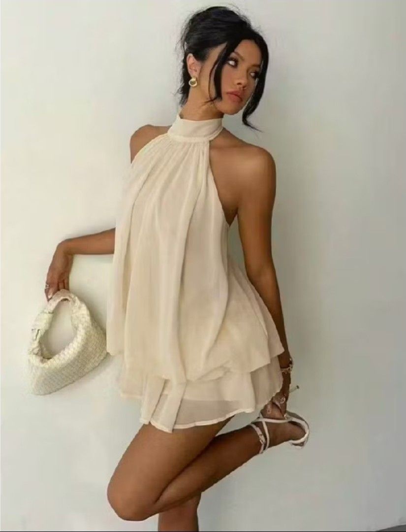 Cream Halter Neck Tiered Mini Dress (Category: Dresses) located in Navotas City. Submitted by _kwekpreloved (Listing ID 1461610926, Image 1). Description: - Cream halter neck dress - Tiered skirt design - Lightweight and flowy fabric - Ideal for summer days or beach vacations - Versatile: dress up or down for parties or casual outings - Comfortable and chic style - S-M.