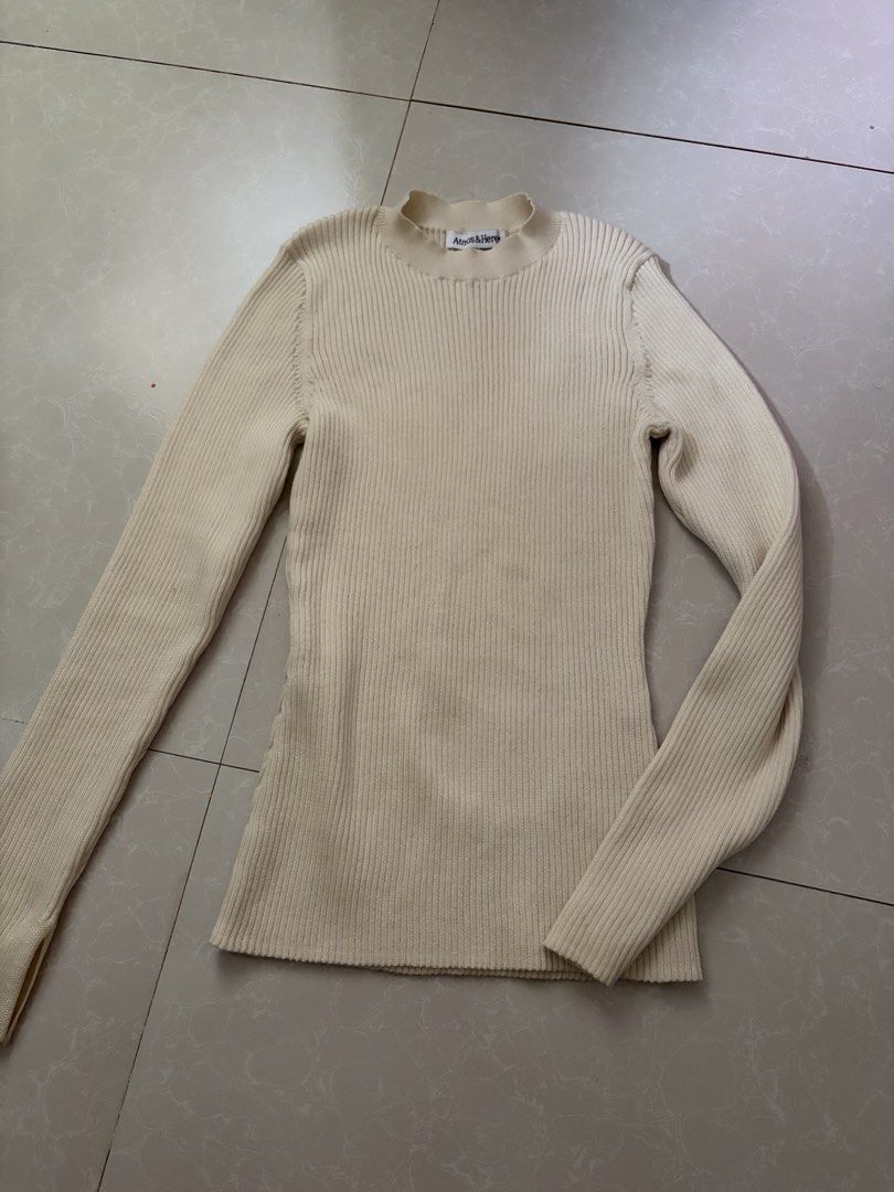 Cream knit sweater (Category: Longsleeves) located in Las Pinas. Submitted by bibliomomma (Listing ID 1461657922, Image 1). Description: Cream ribbed knit sweater from Atmos&Here. Soft and stretchy material with a simple fitted design, perfect for layering when traveling out of the country MOP Gcash.