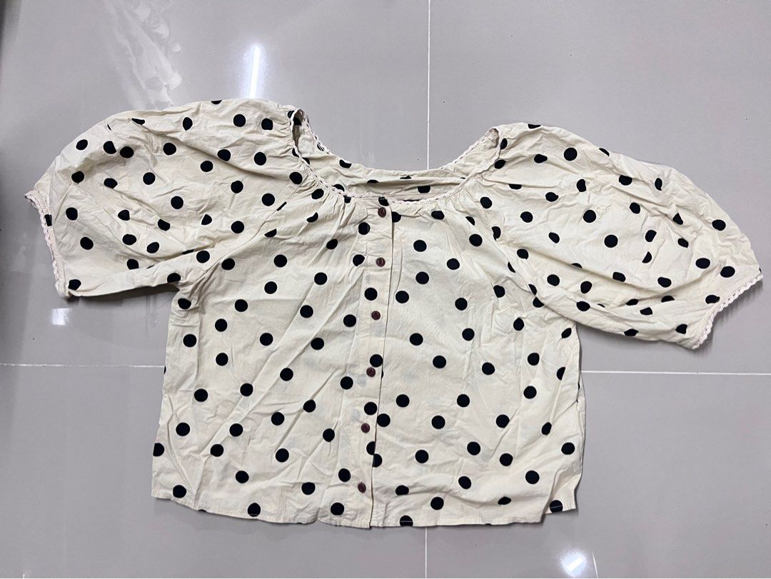 Cream Polka Dot Puff Sleeve Top (Category: Blouses) located in Manila. Submitted by sossa4 (Listing ID 1461713251, Image 2). Description: - Cream top with chic black polka dots - Features stylish puff sleeves with delicate lace trim - Convenient button-up front - size: medium-large .