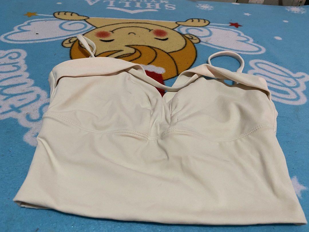 Cream V-Neck Ruched Crop Top Spaghetti Straps (Category: Activewear) located in Manila. Submitted by resi.diaz (Listing ID 1461629831, Image 3). Description: - Cream colored crop top - V-neck design with front ruching - Spaghetti straps - Stretchy material - Versatile for layering or wearing on its own.