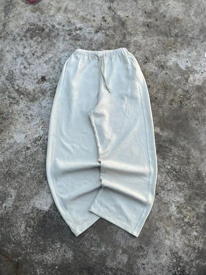 Cream Wide Leg Drawstring Pants (Category: Activewear) located in Trece Martires City. Submitted by jhaaamess (Listing ID 1461706214, Image 1). Description: - Cream colored wide-leg pants - Elastic waistband with adjustable drawstring - Side pockets and one back pocket - Comfortable and casual design - Perfect for everyday wear.