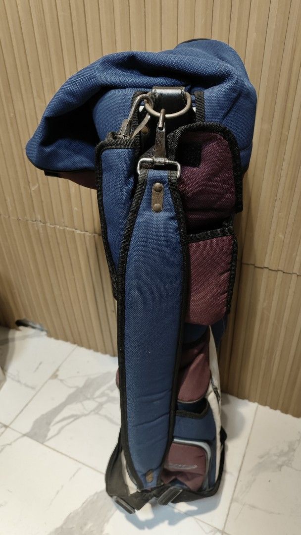 Crew Golf Bag - Blue, Burgundy, Cream (Category: Golf) located in Bulacan. Submitted by babz30261 (Listing ID 1461644218, Image 2). Description: - Stylish blue and burgundy golf bag with cream accents. - Features the 'Crew' logo and 'Enjoying golf in a natural setting' text. - Multiple zippered pockets for ample storage. - Includes a convenient shoulder strap. - Ideal for safely and easily carrying your golf clubs..