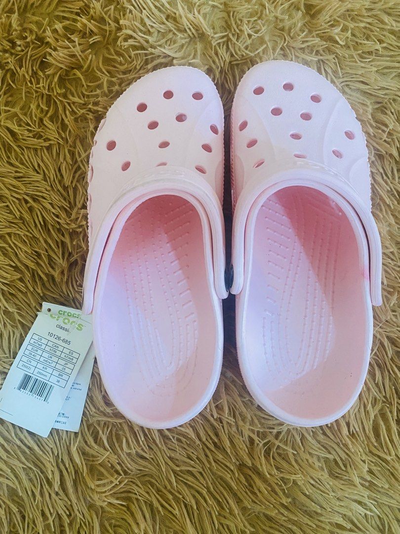CrocsPink Clogs (Category: Slippers and slides) located in San Jose del Monte. Submitted by cityhanter007 (Listing ID 1461639506, Image 1). Description: - Pink Crocs Classic Clogs - Size: US Women's 7 / Men's 9 - Perfect for casual outings or lounging at home - Easy slip-on and slip-off design.