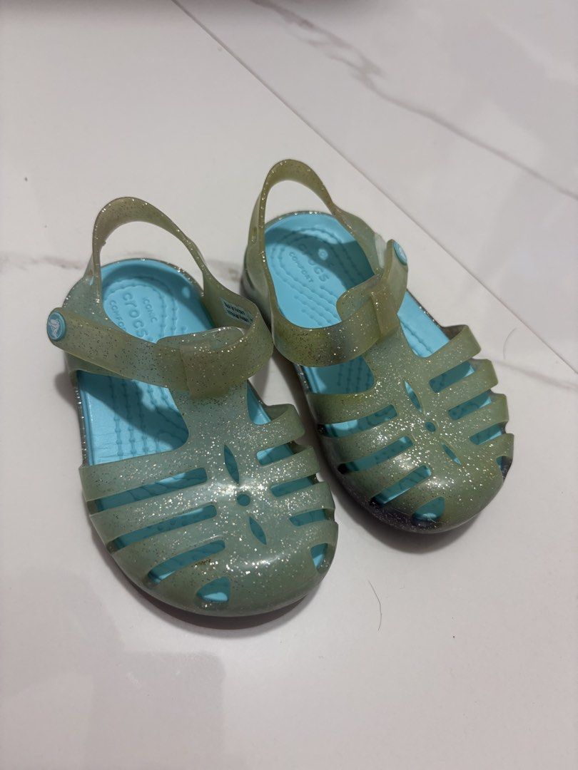 C5 (12cm) Crocs Glitter Jelly (Category: Babies & Kids Fashion) located in Cavite. Submitted by crisalyn___ (Listing ID 1461715099, Image 2). Description: - Cute Crocs jelly sandals for kids - Sparkly glitter detail - Translucent aqua blue color - Easy strap closure - Great for beach or pool - Soles with good grip - Please check photos for exact condition.